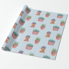 Succulte en cacti op blauw cadeautje tegen achterg cadeaupapier