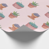 Succulte en cacti op roze cadeauomslag achtergrond cadeaupapier (Hoek)