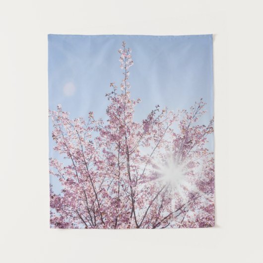 sun rays pass through pink flowers of a wow tree wandkleed (Voorkant)