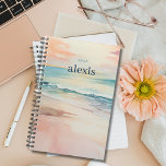 Sunrise Beach |  gepersonaliseerde jaarplanner Planner<br><div class="desc">Blijf georganiseerd en geïnspireerd met onze aanpasbare planner met een tropisch strandontwerp met een zachte zonsopgang strandscène aan zowel de voor- als achterkant. Personaliseer het met jouw naam en het jaar voor een planner die uniek is voor jou. Met voldoende ruimte voor het plannen, notities maken en het stellen van...</div>