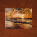 Sunrise en Seascape Legpuzzel<br><div class="desc">Een gloeiende hemel als de zon boven het zee stijgt. Een zeemerkop met kleuren van sinaasappel van de stijgende zon.</div>