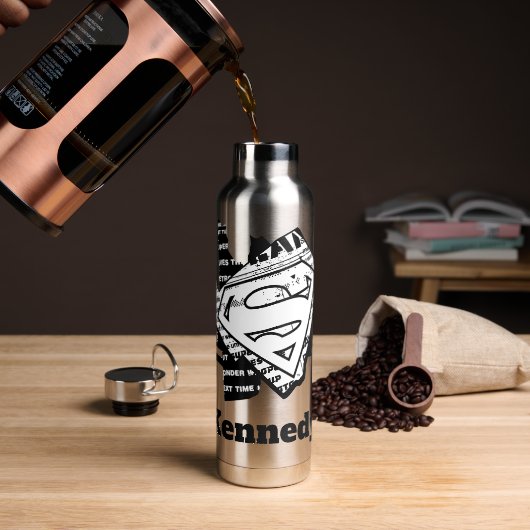 Supergirl krantenpapier S-Shield Waterfles (Koffie)