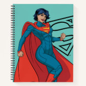 Supergirl zweven in blauw pak notitieboek (Voorkant)