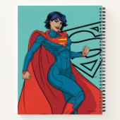 Supergirl zweven in blauw pak notitieboek (Achterkant)