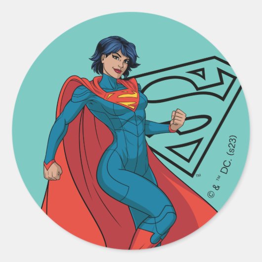 Supergirl zweven in blauw pak ronde sticker (Voorkant)