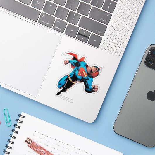 Superman in pak sticker (Laptop met iPhone)