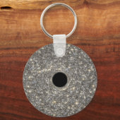 Superzwaar zwart gat in het midden van een sterren sleutelhanger (Achterkant)