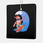Surfende kerstman keramisch ornament (Links)