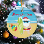 Surfende strand Santa Tropisch Keramisch Ornament<br><div class="desc">Dit ontwerp werd gecreeerd door digitale kunst. Het kan op het verstrekte gebied worden gepersonaliseerd of door de foto te veranderen of uw eigen woorden toe te voegen worden aangepast. Neem contact met me op colorflowcreations@gmail.com als je dit ontwerp op een ander product wilt gebruiken. Koop mijn oorspronkelijke abstracte acrylschilderij...</div>