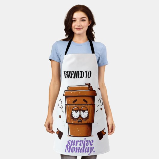 "Survive Monday. BREWED to…" Coffee Mug – Fun Desi Schort (Gedragen)