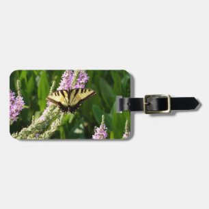 Swallowtail Butterfly op Paarse wilde bloemen Bagagelabel