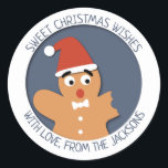 Sweet Christmas cartoon gebeten peperkoek man Ronde Sticker<br><div class="desc">Lieve kerstwensen! Deze leuke kerst ronde sticker is voorzien van een zoete gebeten peperkoek man met een rood pet, op een elegante blauwe achtergrond. Plak het aan je cadeaus of enveloppen om je vriend een lief kerstfeest te wensen. U kunt de formulering van deze feestelijke sticker eenvoudig aanpassen met uw...</div>