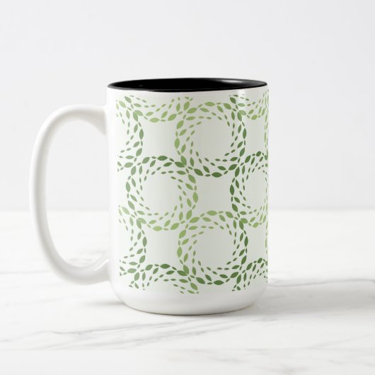 Swirling green leaf pattern tweekleurige koffiemok (Links)