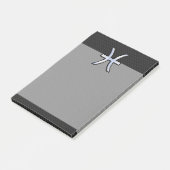 Symbool van de ringzegen op zwarte slang post-it® notes (Schuin)