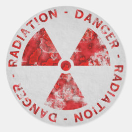 Symboolsticker met vervormd rood stralingssymbool ronde sticker