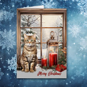 Tabby kat en kaarsen in de winter raam kerst