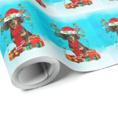 Tachshund in sneeuw met kerstcadeaus cadeaupapier (Rol Hoek)