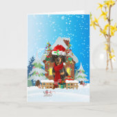 Tachshund in sneeuw met kerstcadeaus kaart (Gele Bloem)