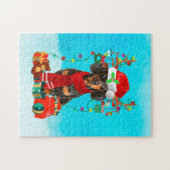 Tachshund in sneeuw met kerstcadeaus legpuzzel (Horizontaal)