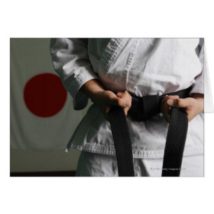 Taekwondo Fighter Tightening Belt