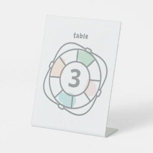 Tafelnummer reddingsboei baby shower met maritiem reclamebord met voetstuk