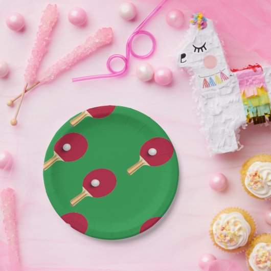 Tafeltennisracket en bal op groen papieren bordje (Feest)