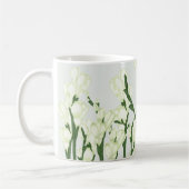 Tak van witte Freesia. Koffiemok (Links)