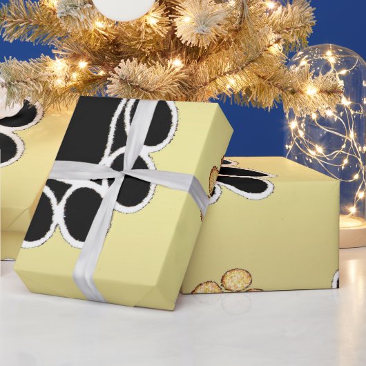 Tan- en zwart-witafdrukken op een gouden achtergro cadeaupapier (Feestdagen)