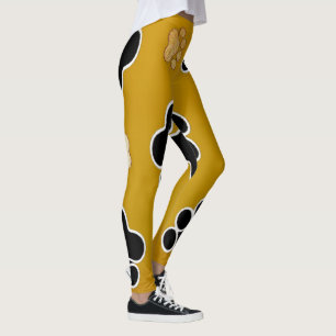 Tan- en zwart-witafdrukken op een gouden achtergro leggings