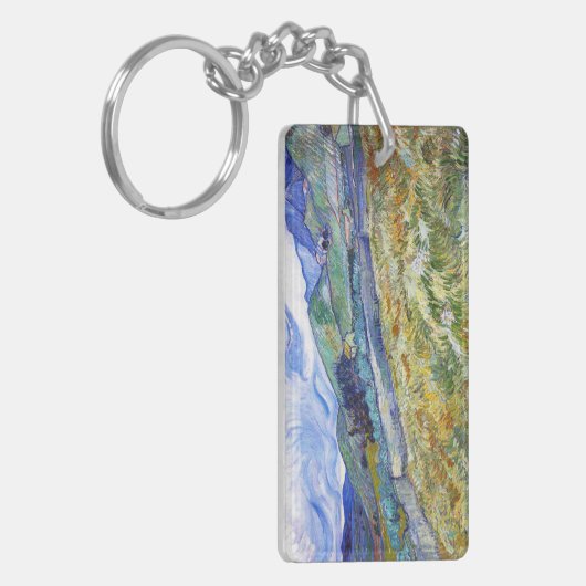 Tarweveld met bergen in de achtergrond sleutelhanger (Voorkant Links)