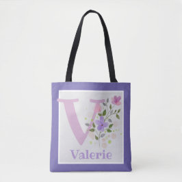 Tas heeft eerste initiaal plus naam met bloemen