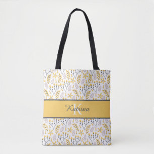 Tas met geborduurde bloemen en monogram