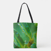 Tas met regendruppels op groene bladeren (Achterkant)