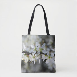 Tas met witte bloesemfoto's over de hele afdruk