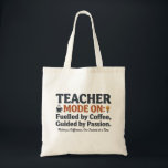 Teacher Mode On style quotes Tote Bag<br><div class="desc">A motivational teacher-themed design celebrating the dedication and passion educators bring to their classrooms every day. Featuring the phrase “Teacher Mode On – Fueled by Coffee, Guided by Passion” with charming icons like coffee, books, a lightbulb, and a pencil, this design highlights the energy, creativity, and commitment teachers put into...</div>