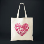 Teaching Is a Work of Heart Tote Bag<br><div class="desc">A bold and inspiring typography design featuring the phrase “Teaching Is a Work of Heart” arranged in a heart shape. The vibrant pink lettering and playful retro-style font create a warm and motivational design that celebrates the dedication and passion of teachers.</div>