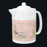 Teapot met roze Floral en vogelontwerp Theepot<br><div class="desc">Teapot met een  lichtroze florale en vogelvormig ontwerp. De bloemen zijn wit,  de vogel is roze met open vleugels en er zijn  groene bladeren. Bedankt naar Creative Fabrica,  en de Hungryjpeg voor enkele elementen in het ontwerp.</div>