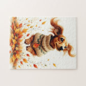 Teckel die in de herfstbladeren speelt legpuzzel (Horizontaal)