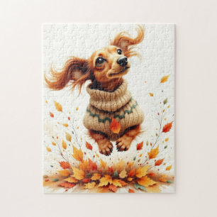 Teckel die in de herfstbladeren speelt legpuzzel