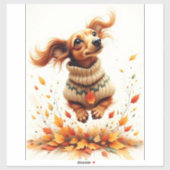 Teckel die in de herfstbladeren speelt sticker (Vel)