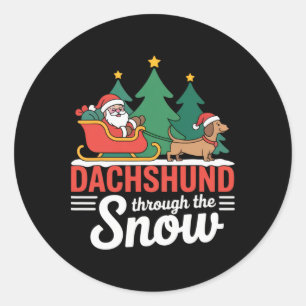 Teckel door de sneeuw feestelijke kerstman ronde sticker