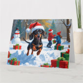 Teckel loopt in de sneeuw met kerst Pet Kaart (Voorkant)