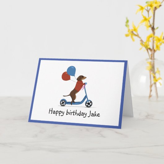 Teckel op scooter met ballonnen kaart (Gele Bloem)
