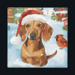 Teckel Winter Wonderland Christmas Joy Magneet<br><div class="desc">Dit feestelijke ontwerp vangt de vrolijke sfeer van het vakantieseizoen, met een schattige pup die een kerstmuts draagt. De hond is genesteld in een winterwonderland, compleet met een sneeuwpop, een versierde kerstboom en prachtig ingepakte cadeaus. Sneeuwvlokken herfsten zachtjes en voegen een magische toets toe aan het tafereel, terwijl de levendige...</div>
