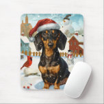 Teckel Winter Wonderland Christmas Joy Muismat<br><div class="desc">Dit feestelijke ontwerp vangt de vrolijke sfeer van het vakantieseizoen, met een schattige pup die een kerstmuts draagt. De hond is genesteld in een winterwonderland, compleet met een sneeuwpop, een versierde kerstboom en prachtig ingepakte cadeaus. Sneeuwvlokken herfsten zachtjes en voegen een magische toets toe aan het tafereel, terwijl de levendige...</div>
