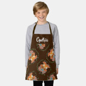 Teddy beer en vlinder op bruin schort (Gedragen)