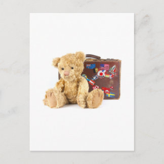 teddybeer en oude koffer met wereldsti briefkaart