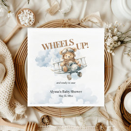 Teddybeer rijdt kleine copiloot omhoog servet