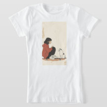 Teenager sitting on skateboard and next to his cat