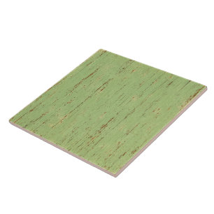 Tegel van keramiek met saliegroene kleur en houtne tegeltje